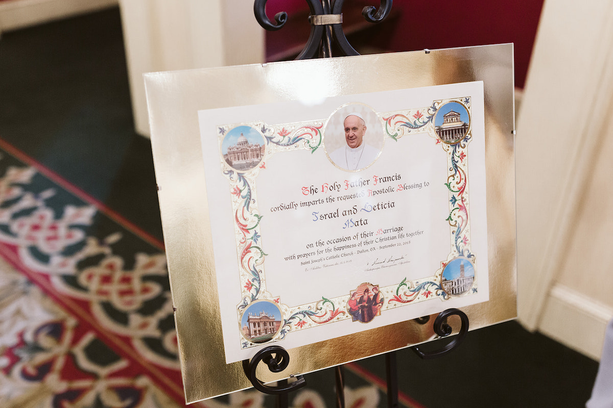 blessing of Pope Francis and marriage license for bride and groom