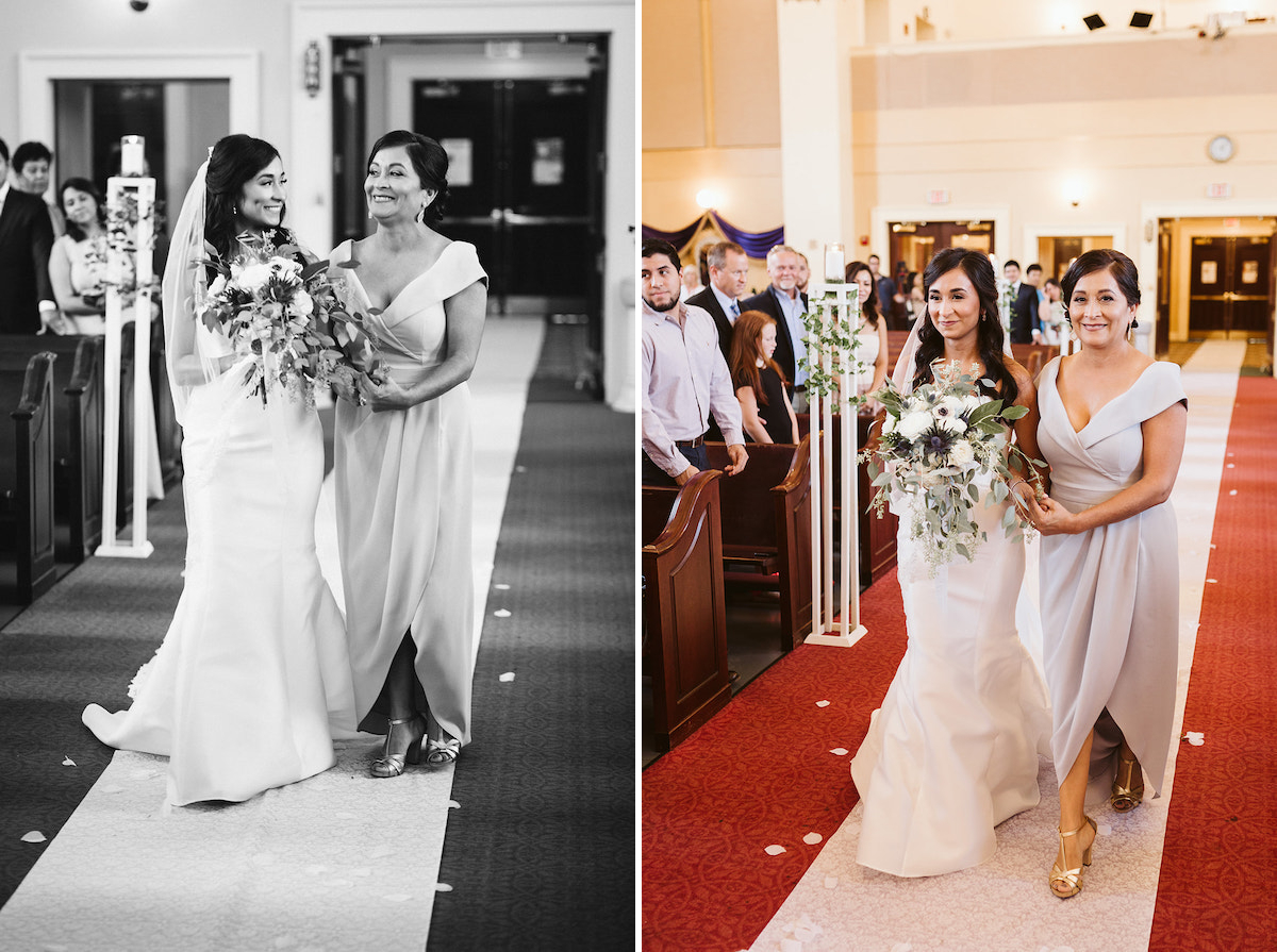 bride escorted by her mother along a white aisle runner as wedding guests stand