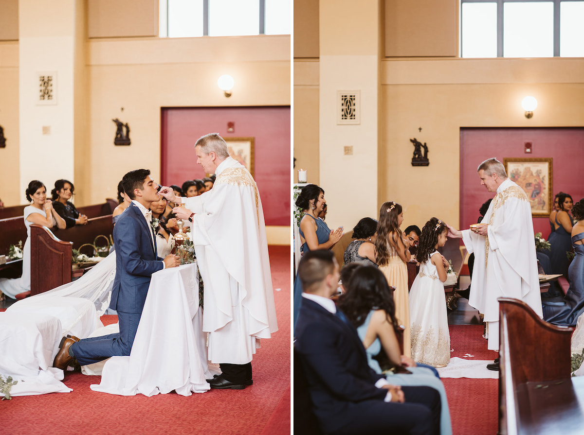 priest places communion bread on grooms tongue