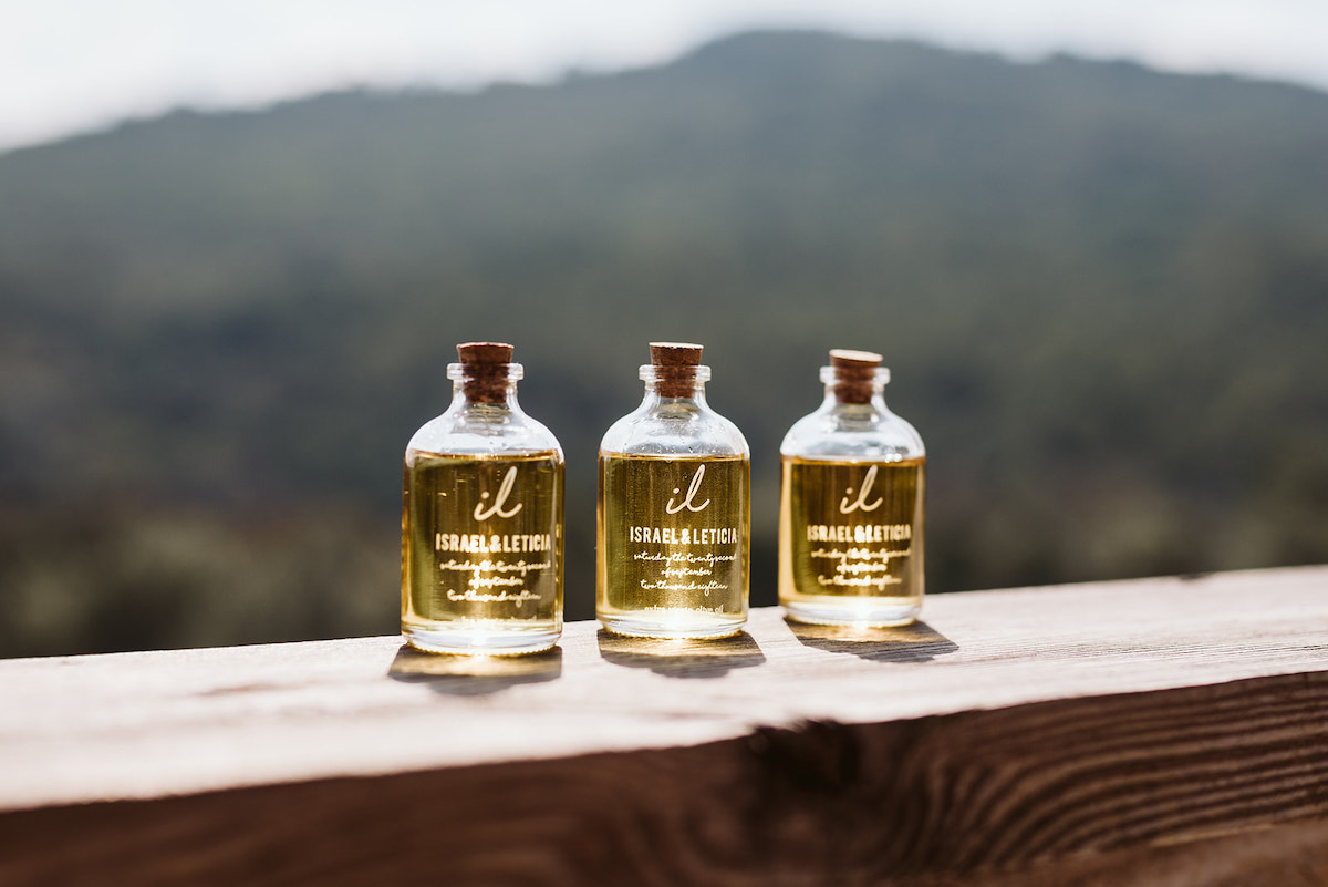 small, branded and corked bottles with bride and grooms names and initials