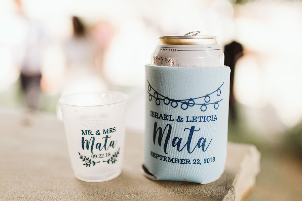 cup and koozie printed with bride and groom names and wedding date