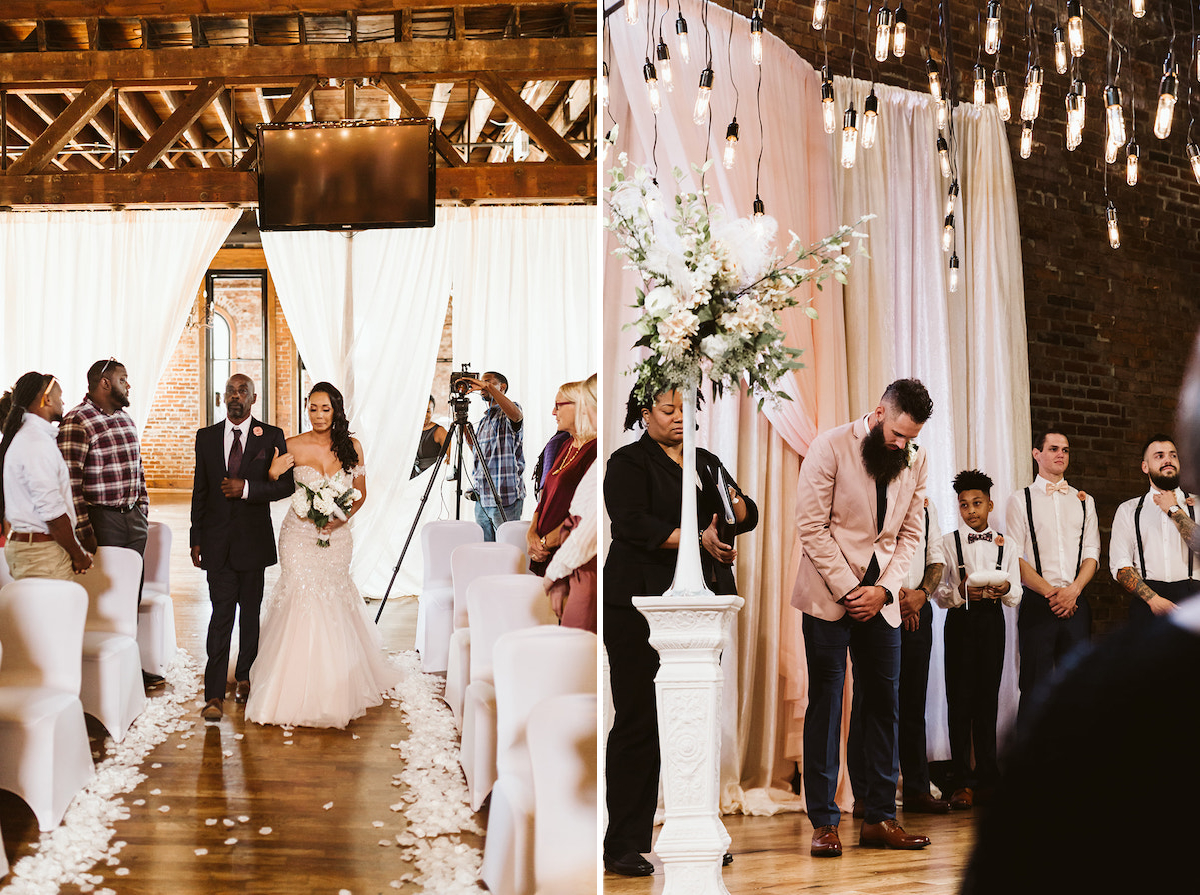groom waits on the stage while bride and her father walk the aisle toward him