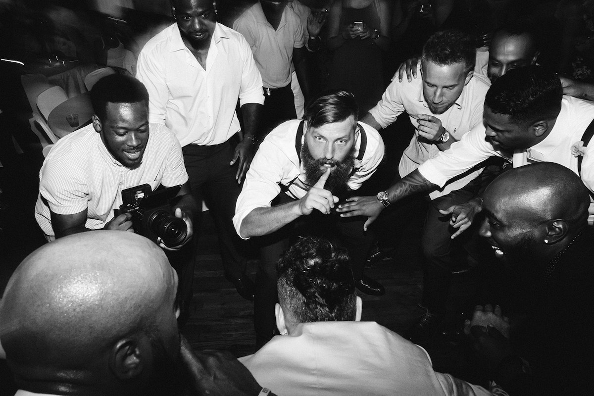 groom and groomsmen dance low together