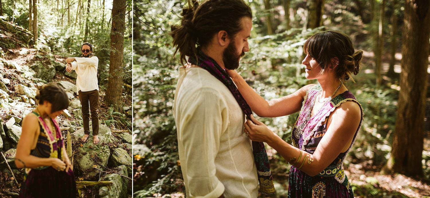woman in colorful Bohemian dress straightens scarf around man's neck