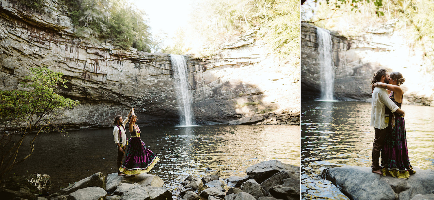 man and woman dressed in Bohemian style dress kiss on rocks at Chattanooga's Foster Falls for wedding portraits