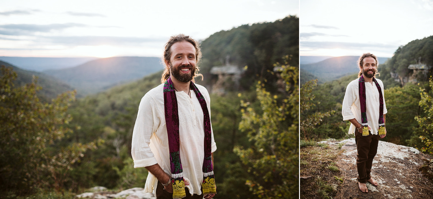 man in white shirt and bright scarf stands barefoot at overlook at Hemlock Falls