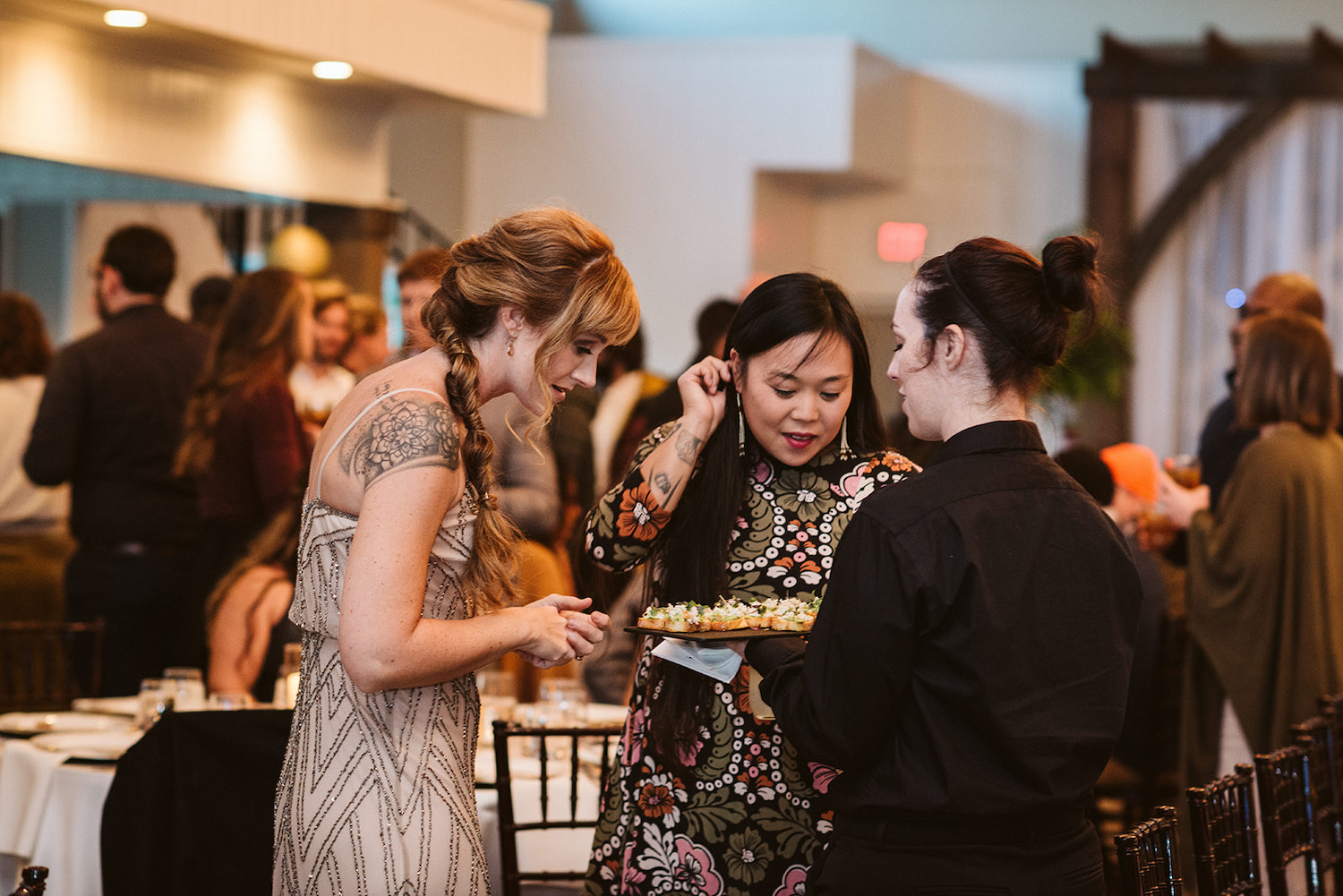 Events with Taste catering serves small scallop appetizer bites to wedding guests