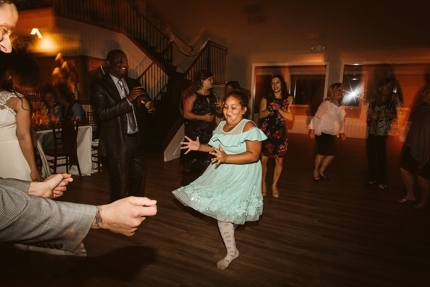young girl dances in a twirling light green dress