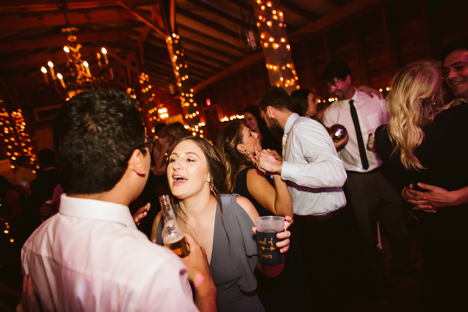 wedding guests dance and sing together