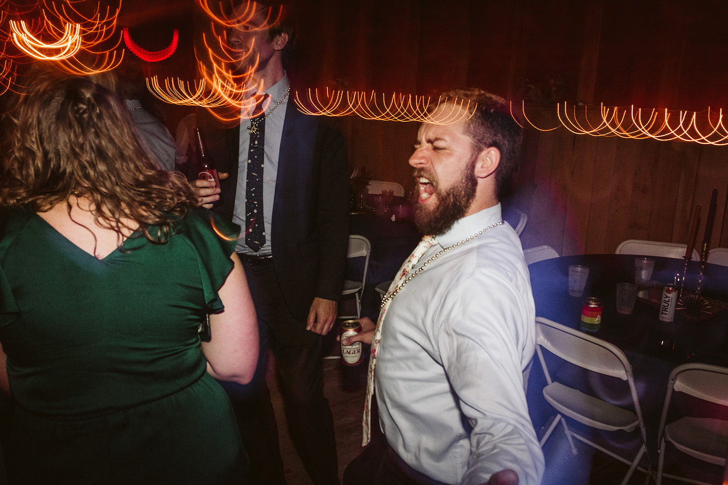 wedding guests dance and sing together