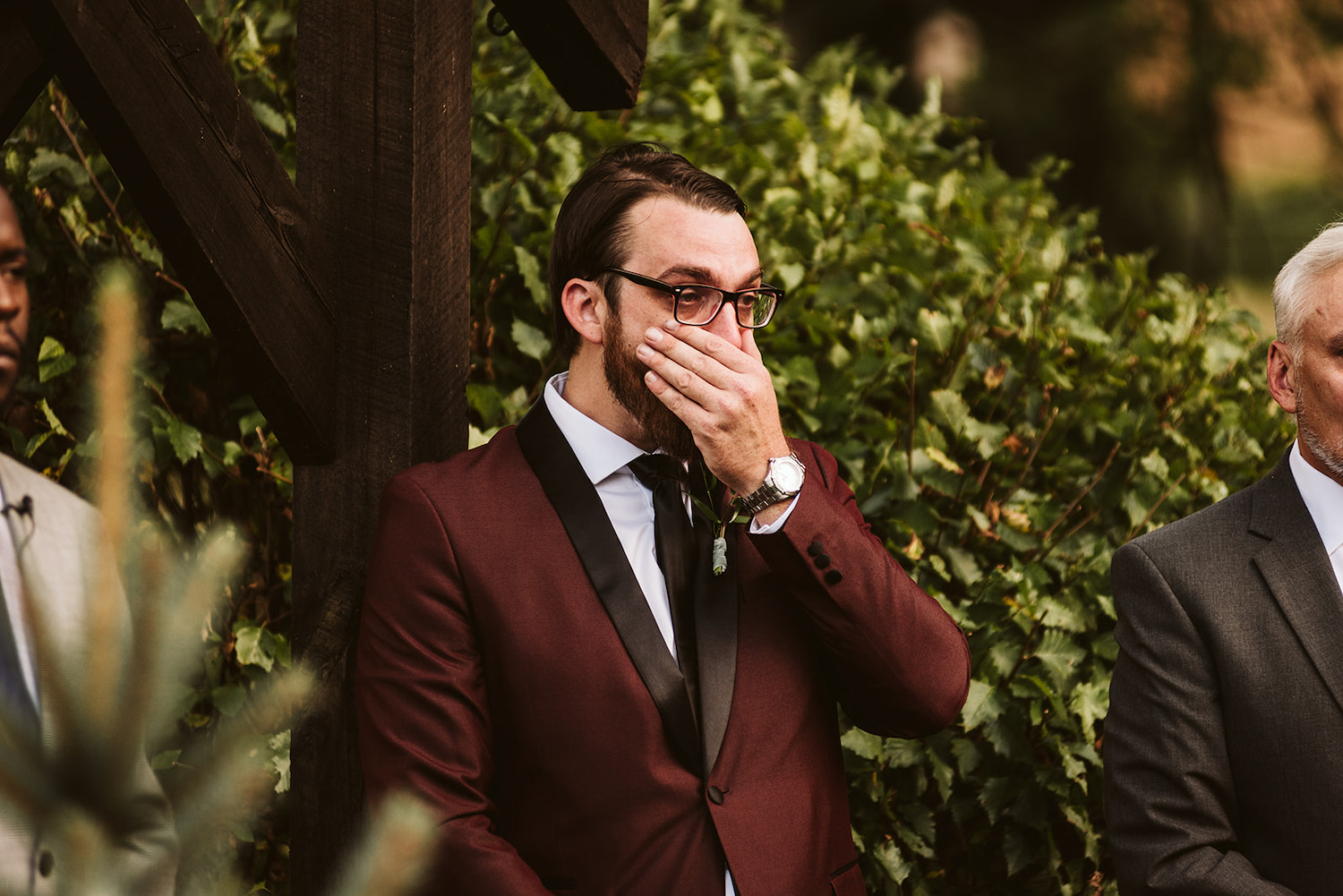 groom wipes away his tears