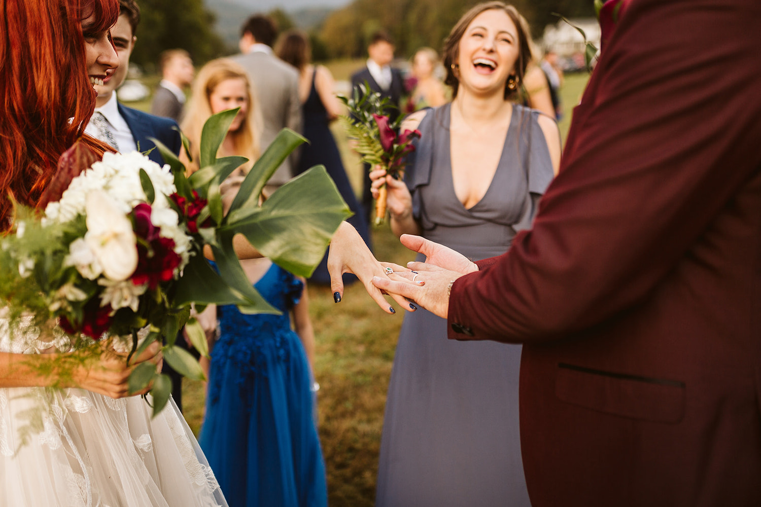 bride and groom hold their hands together to show their rings off