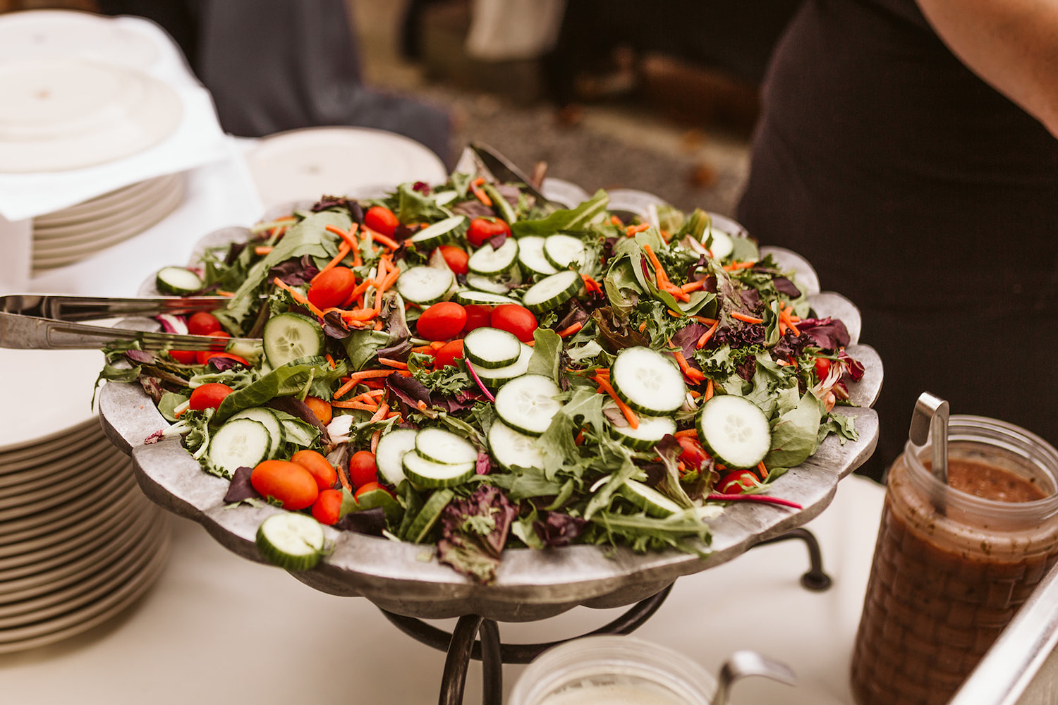 large, green salad with mixed vegetables in a serving bowl