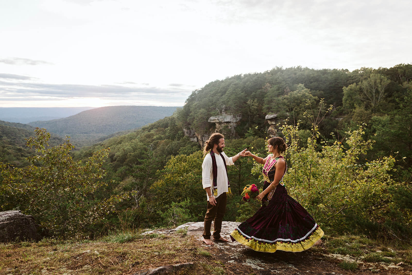 A bride and groom dance on a ridge at their mountain wedding venue in Chattanooga, TN.