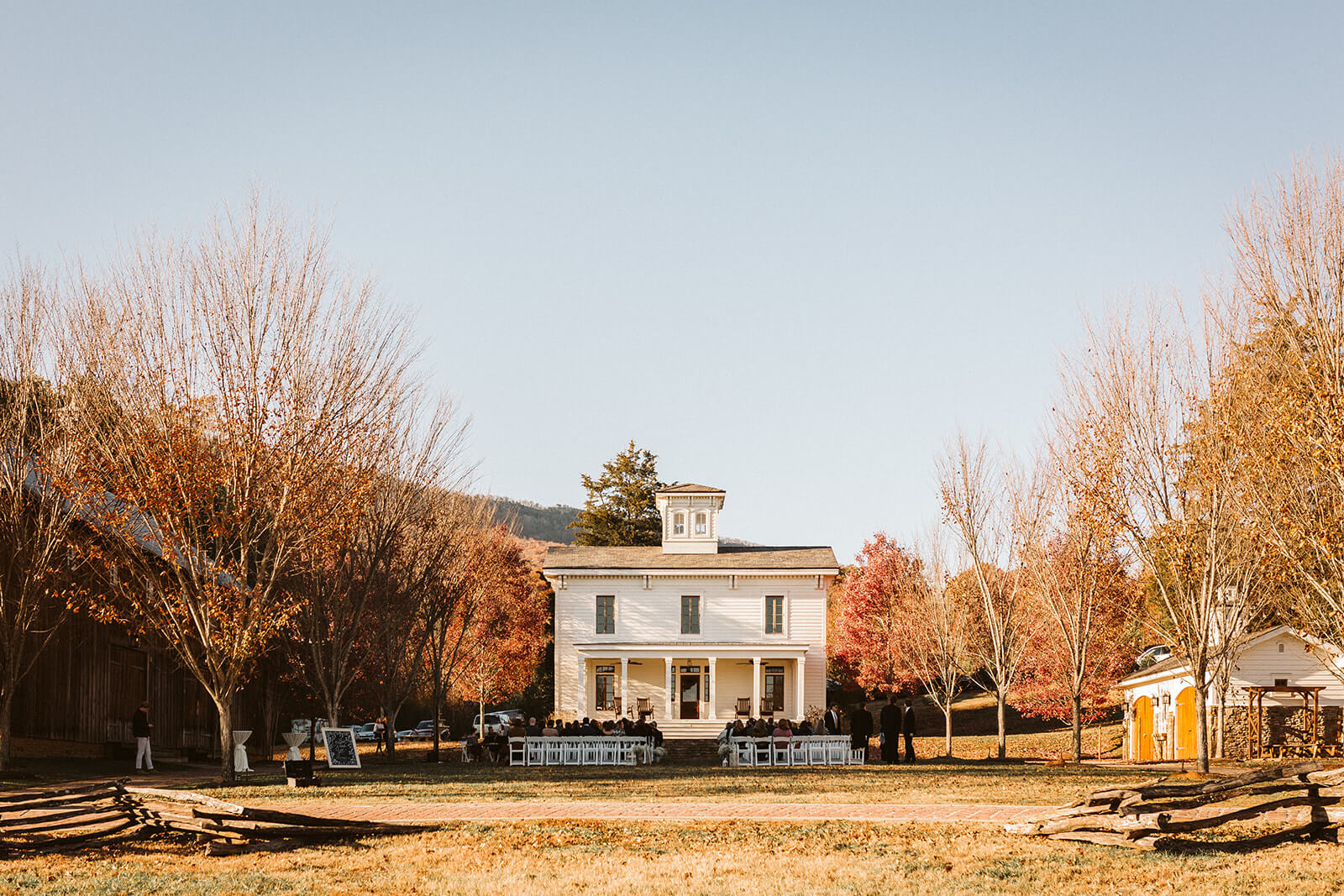 A farmhouse surrounded by fall foliage at a mountain wedding venue in Chattanooga.