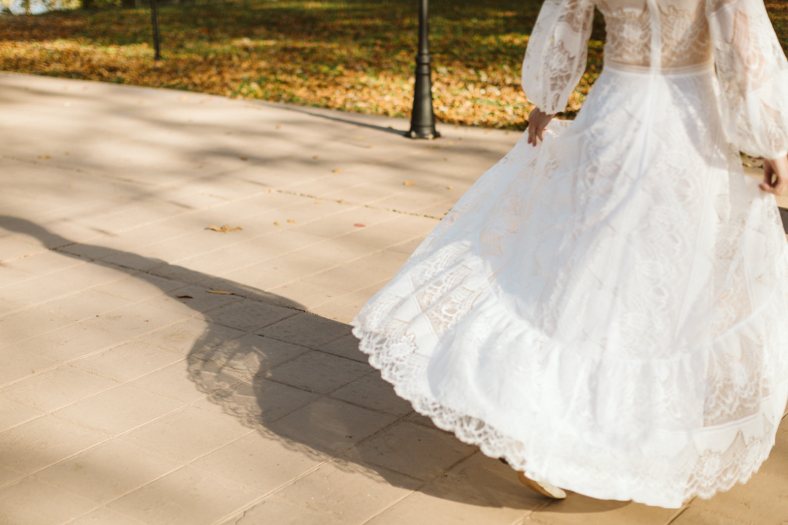 Brides dress flows in the wind as she walks towards her Tennessee Riverplace Wedding