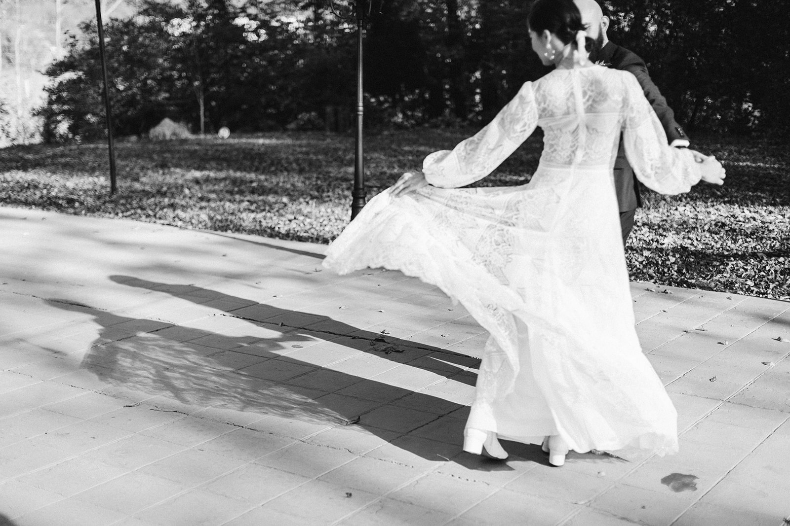 Bride twirls her dress to the side