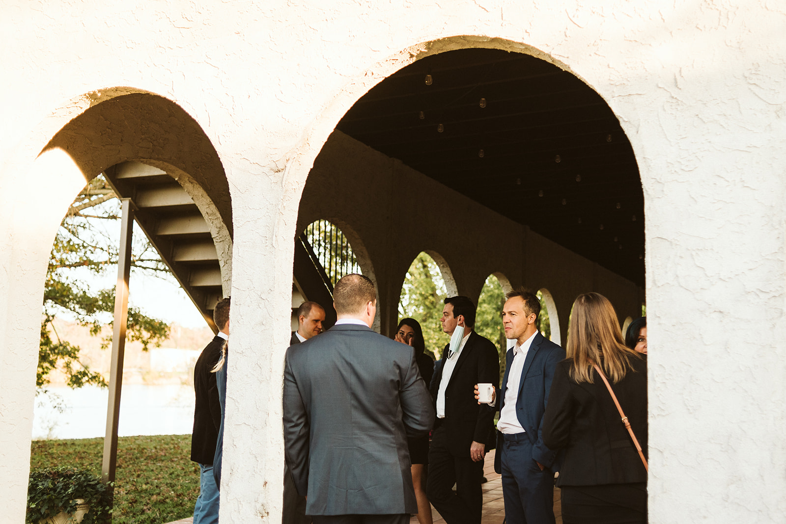 Wedding guests drink coffee and mingle outside the Tennessee Riverplace Wedding