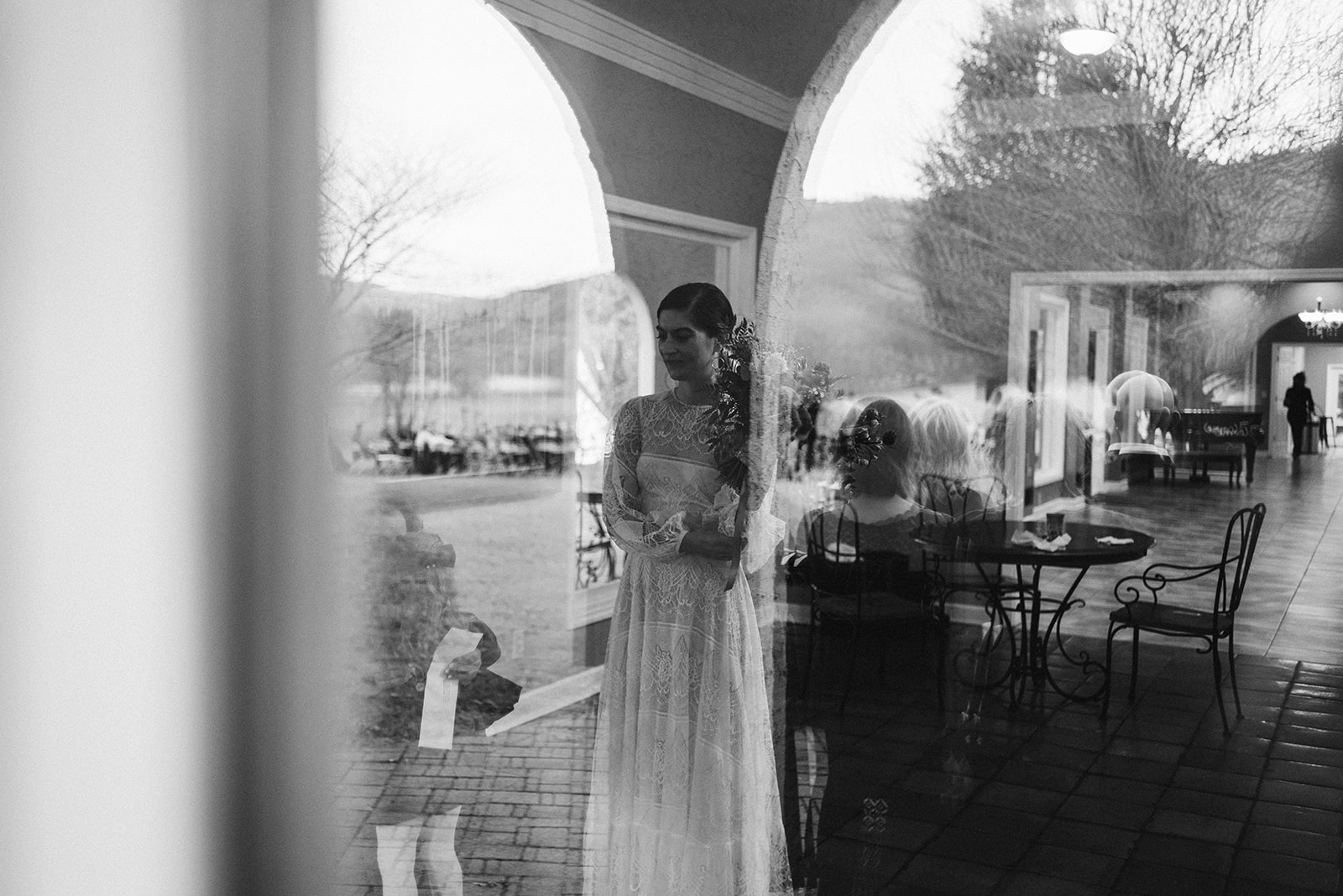 Brides reflection against the glass at her Tennessee Riverplace wedding