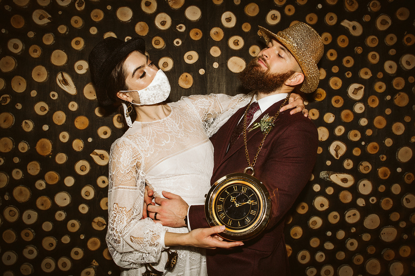 Bride and groom look at eachother as they dress up in props for a photo at their Tennessee Riverplace Wedding