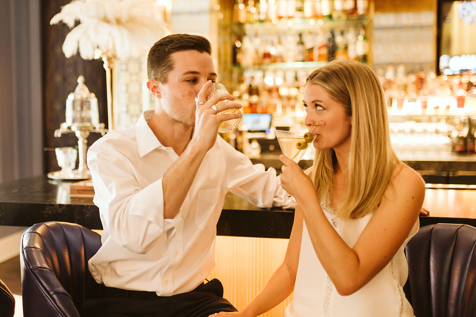 A bride and groom share drinks at The Read House bar.