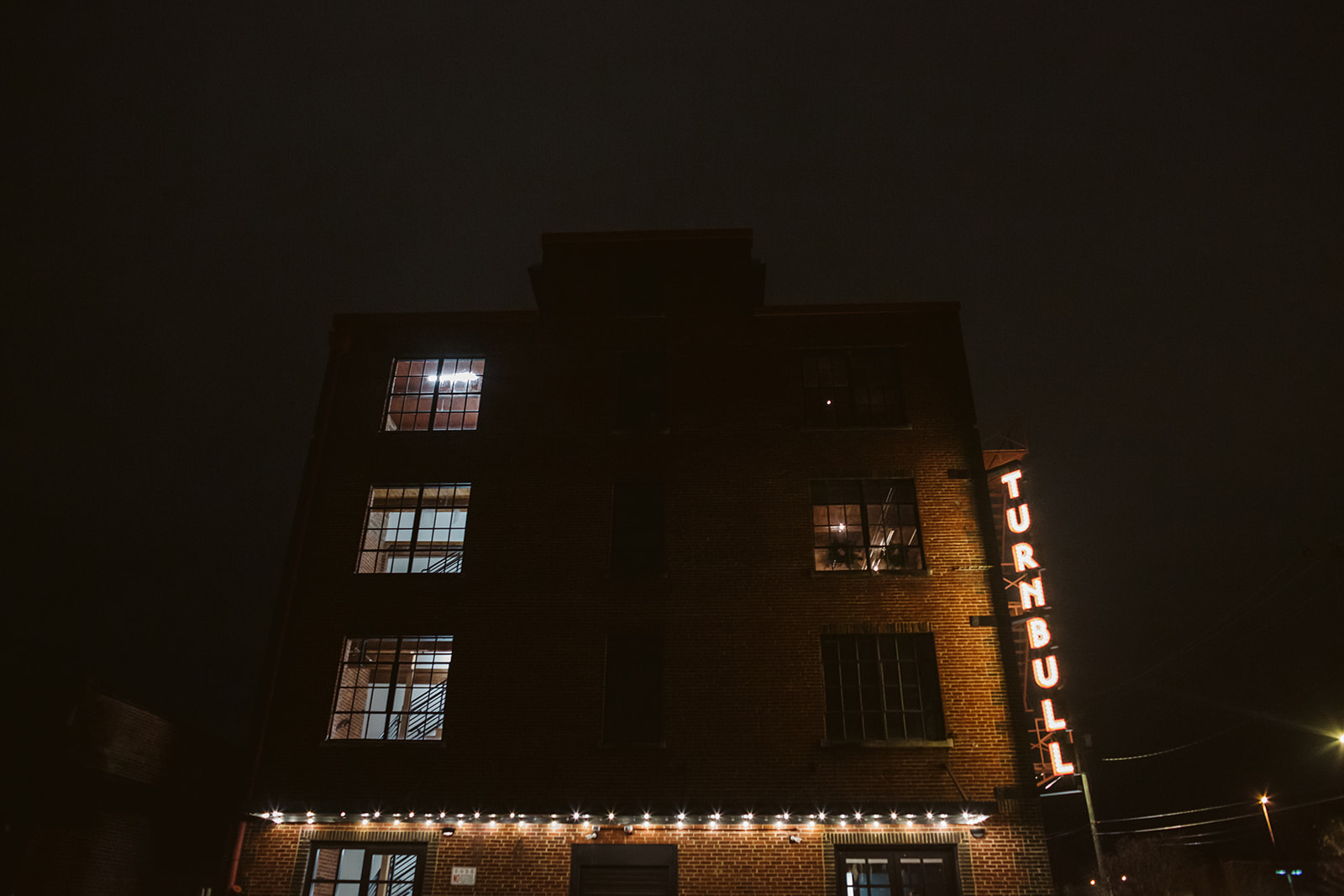 The Turnbull Building from the street outside at night.