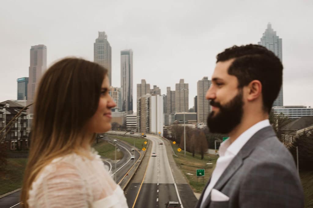 Urban engagement session by Jackson Street Bridge in Atlanta, Georgia. Photo by OkCrowe Photography.