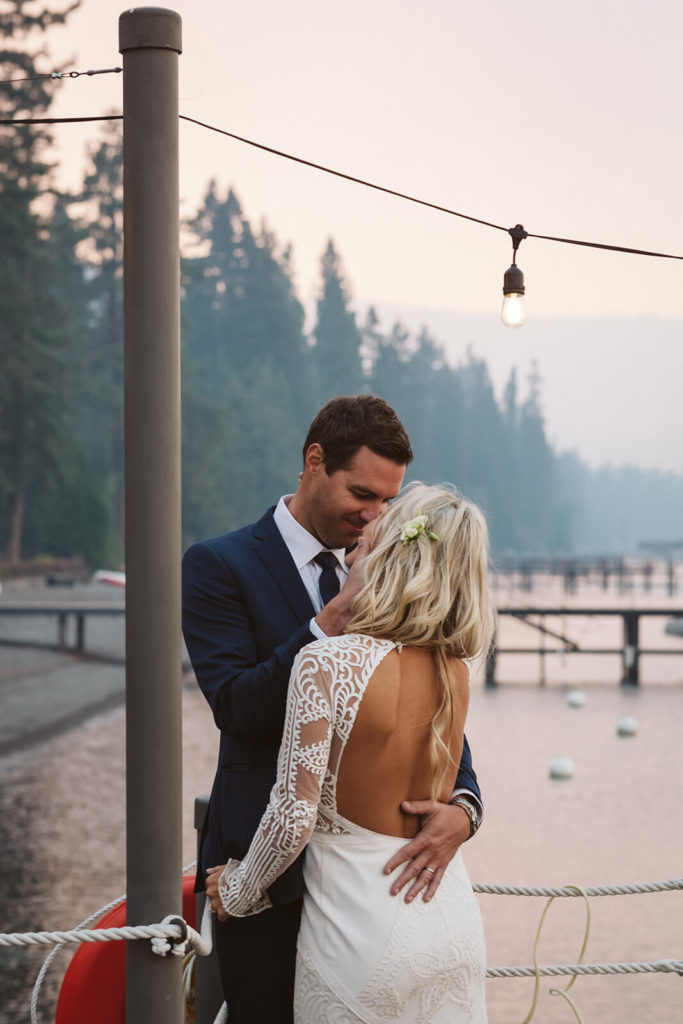 Bride and groom on the pier at the Westshore Cafe and Inn. Photo by OkCrowe Photography.