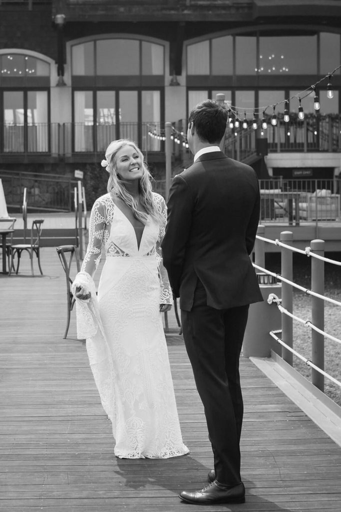 Bride and groom on the pier of the Westshore Cafe and Inn. Photo by OkCrowe Photography.