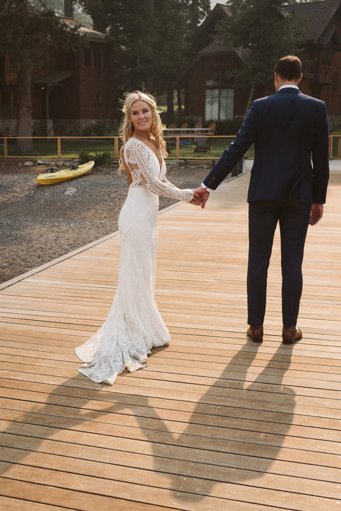 Bride and groom on the pier at the Westshore Cafe and Inn. Photo by OkCrowe Photography.