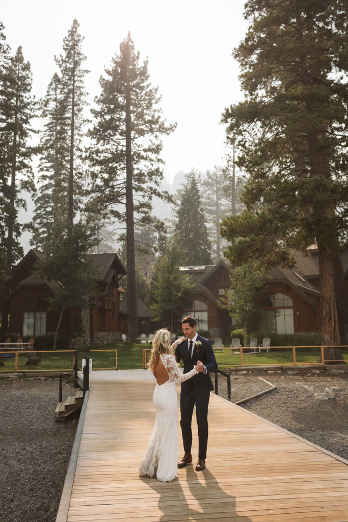 Bride and groom on the pier at the Westshore Cafe and Inn. Photo by OkCrowe Photography.