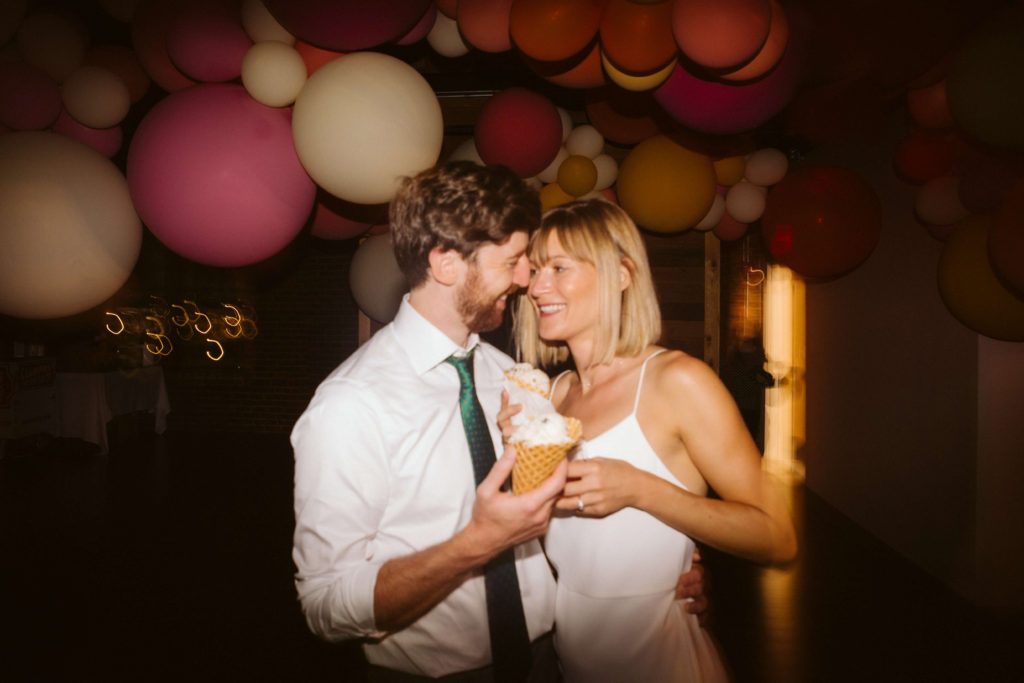 Modern industrial wedding reception at the Turnbull Building in Chattanooga with colorful balloon installation. Photo by OkCrowe Photography.