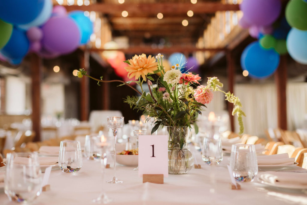 Modern industrial wedding reception at the Turnbull Building in Chattanooga with colorful balloon installation. Photo by OkCrowe Photography.