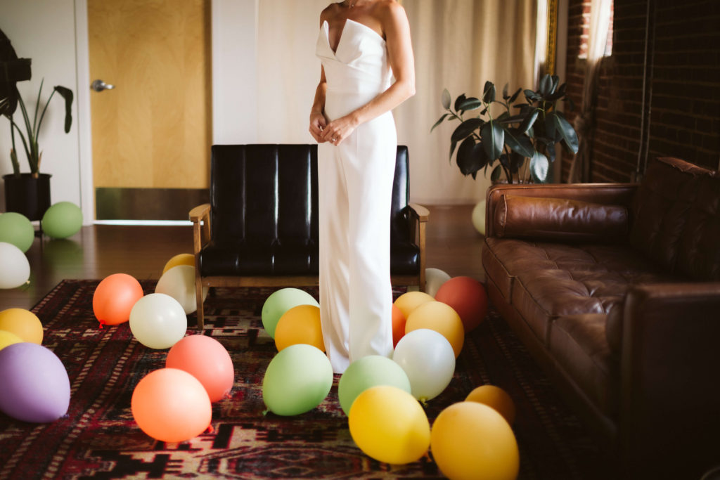 Bride and groom getting ready at the Turnbull Building in Chattanooga. Photo by OkCrowe Photography.