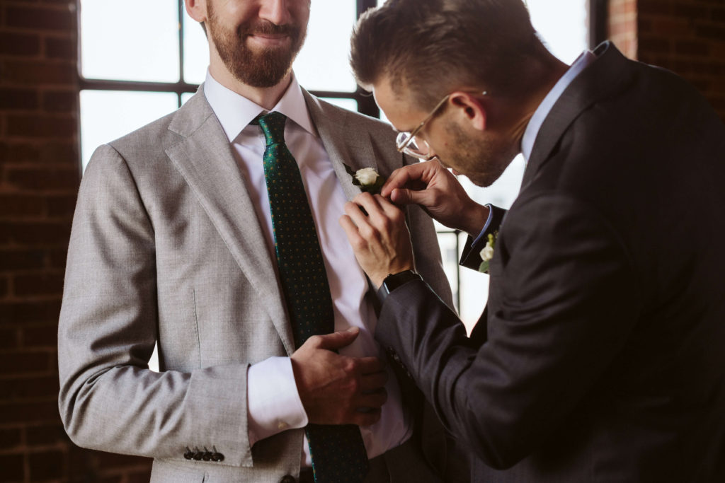 Bride and groom getting ready at the Turnbull Building in Chattanooga. Photo by OkCrowe Photography.