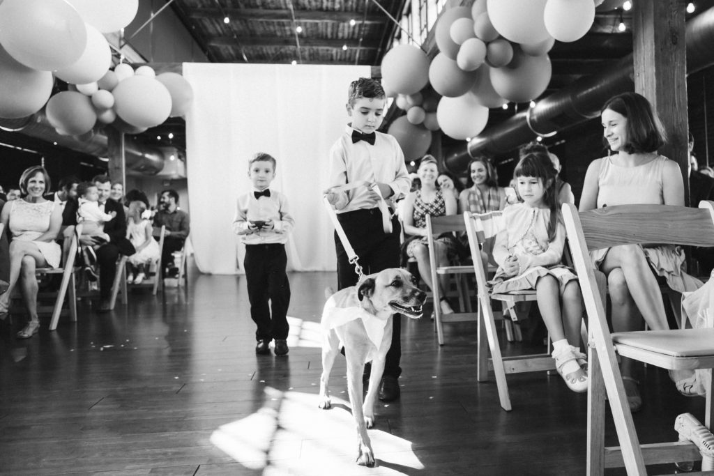 Modern industrial wedding ceremony at the Turnbull Building in Chattanooga with colorful balloon installation. Photo by OkCrowe Photography.