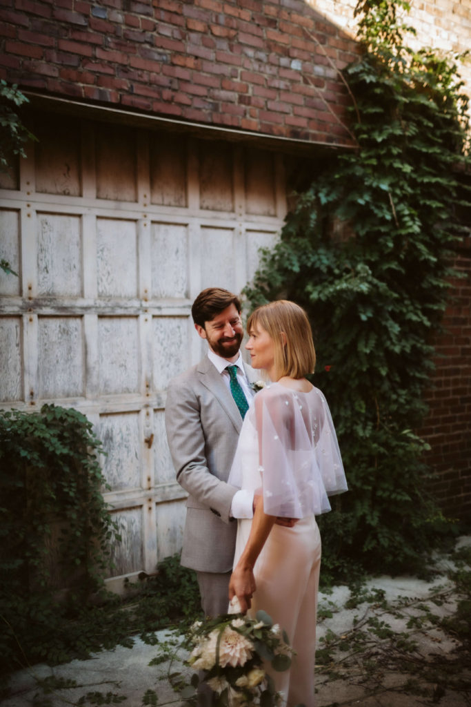 Newlywed portraits behind the Turnbull Building in Chattanooga. Photo by OkCrowe Photography.