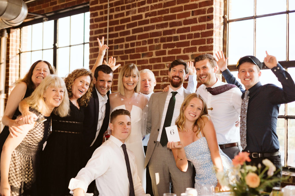 Modern industrial wedding reception at the Turnbull Building in Chattanooga with colorful balloon installation. Photo by OkCrowe Photography.