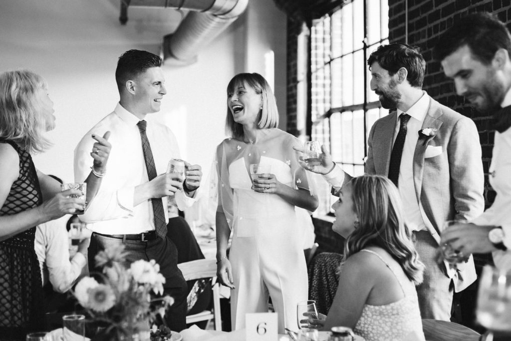 Modern industrial wedding reception at the Turnbull Building in Chattanooga with colorful balloon installation. Photo by OkCrowe Photography.