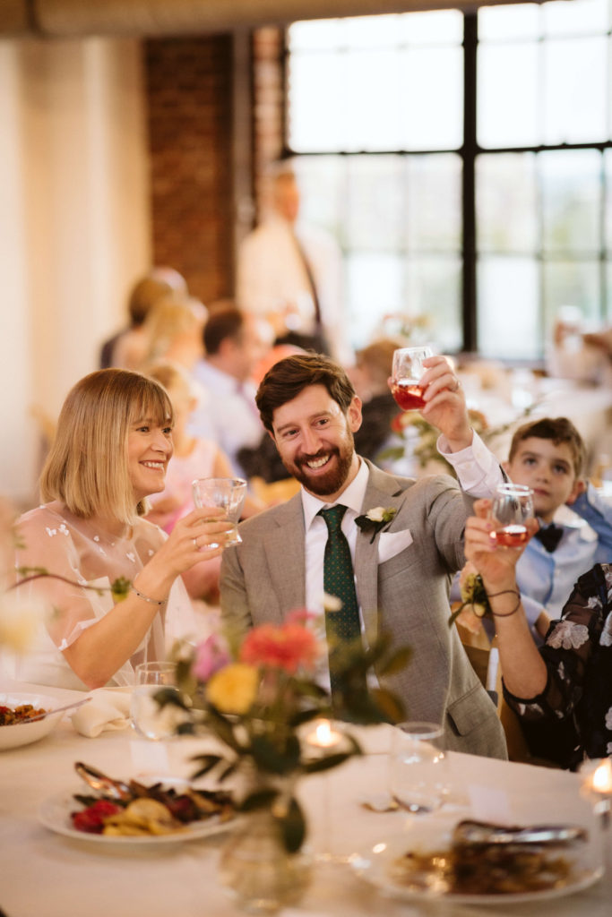 Modern industrial wedding reception at the Turnbull Building in Chattanooga with colorful balloon installation. Photo by OkCrowe Photography.