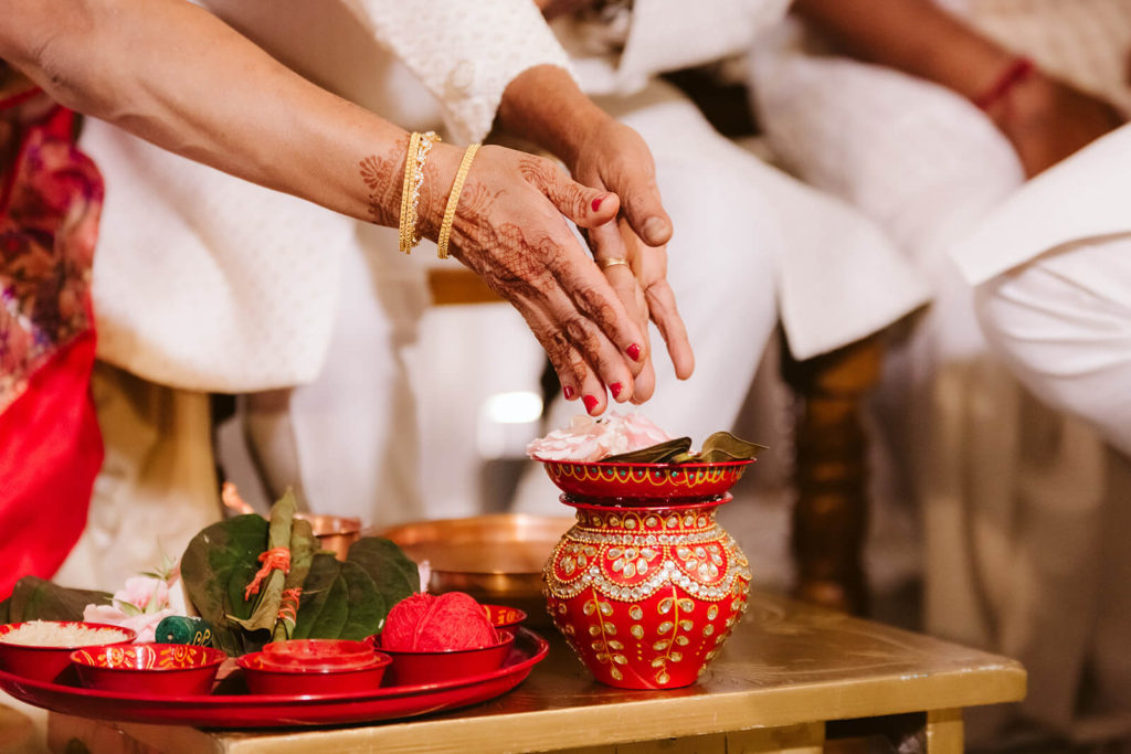 Preparing offerings for a traditional Indian wedding. Photo by OkCrowe Photography.