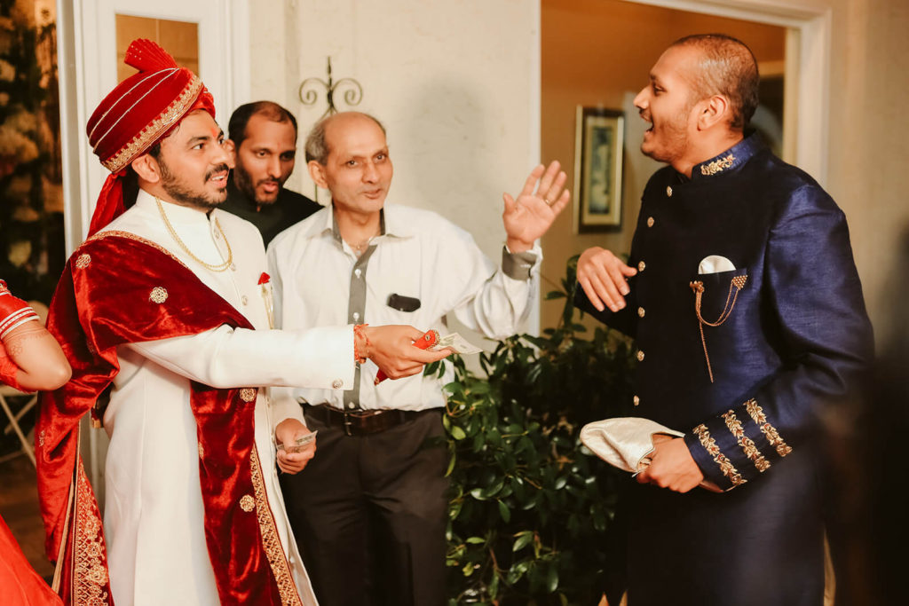 Groom in traditional South Asian wedding clothes with the father of the bride. Photo by OkCrowe Photography.