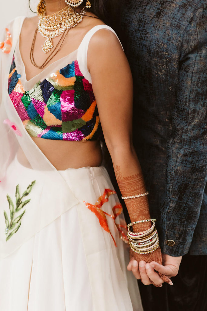 Bride and groom holding hands. Photo by OkCrowe Photography.