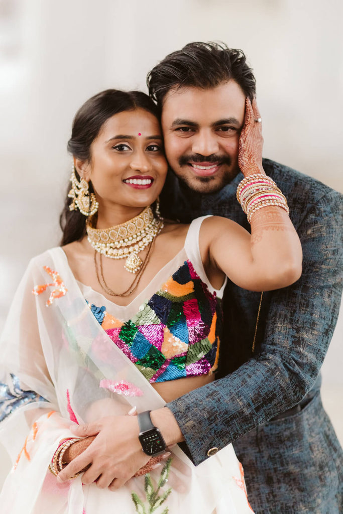 Bride and groom in South Asian wedding garments. Photo by OkCrowe Photography.