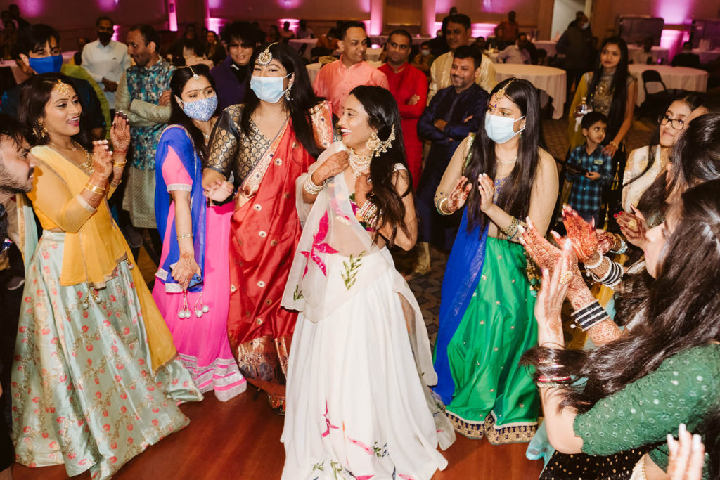 Guest dancing during Sangeet. Photo by OkCrowe Photography.