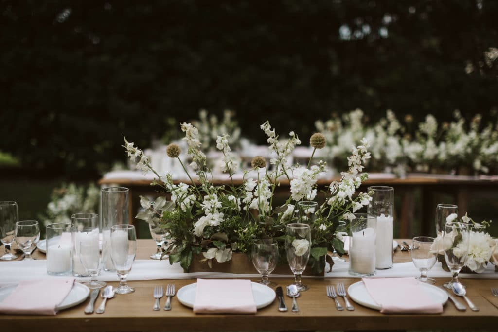 Wedding reception during an upscale backyard wedding. Photo by OkCrowe Photography.