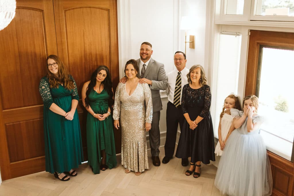 First look with the bride's family. Photo by OkCrowe Photography.