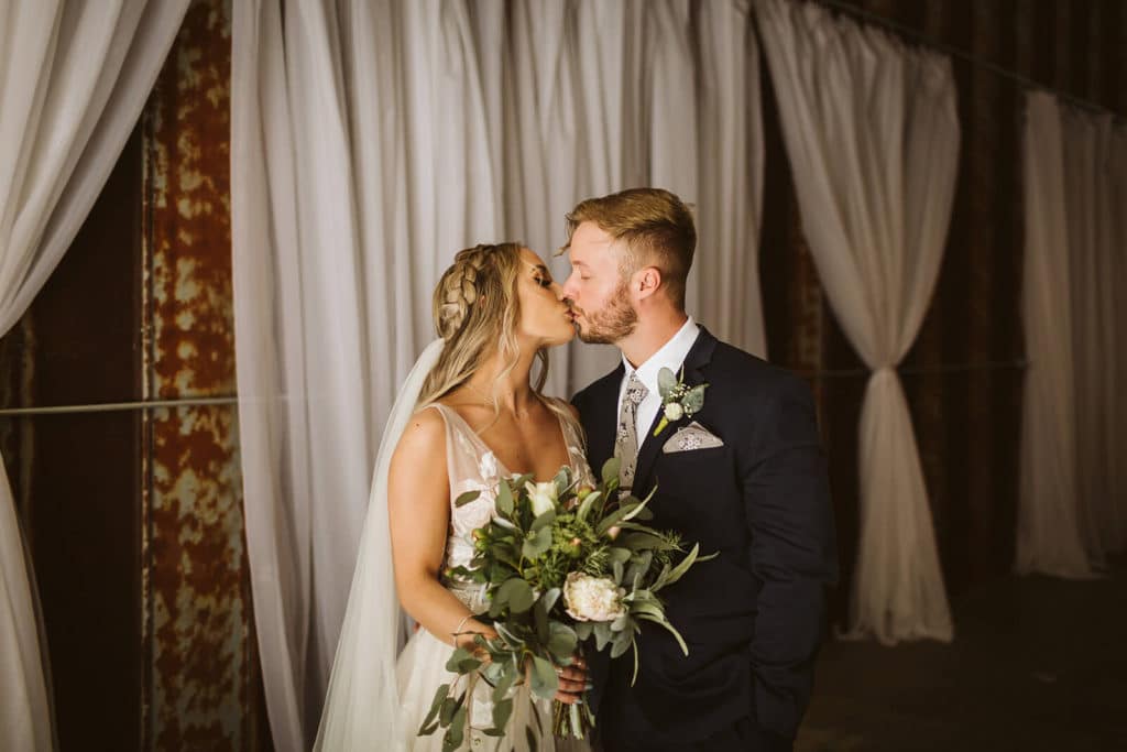 Bride and groom portraits at the Venue at Lilly Lou's. Photo by OkCrowe Photography.