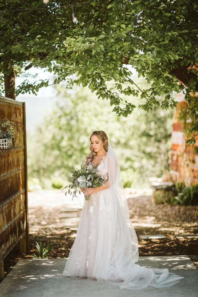 Bride and groom portraits at the Venue at Lilly Lou's. Photo by OkCrowe Photography.