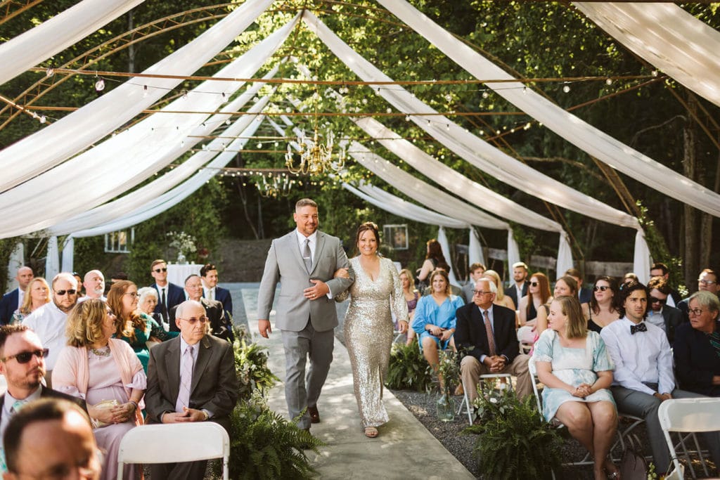 Garden wedding ceremony at the Venue at Lilly Lou's. Photo by OkCrowe Photography.